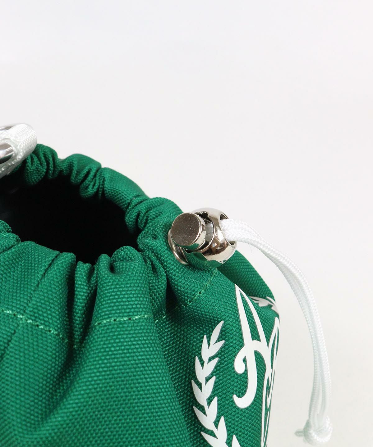 紐調整部分（グリーン）