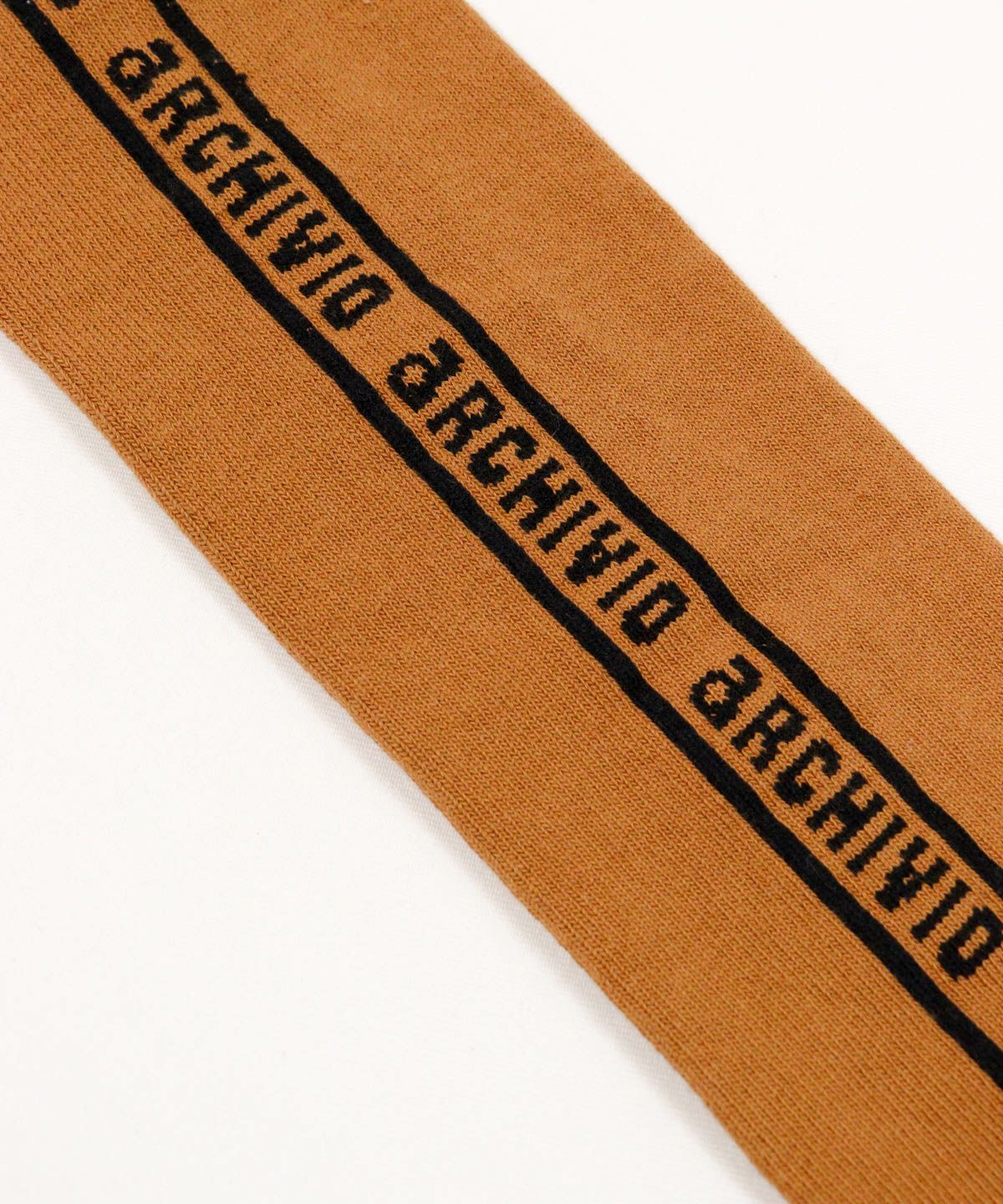 ロゴデザイン部分（キャメル）