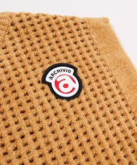 ロゴデザイン部分（キャメル）