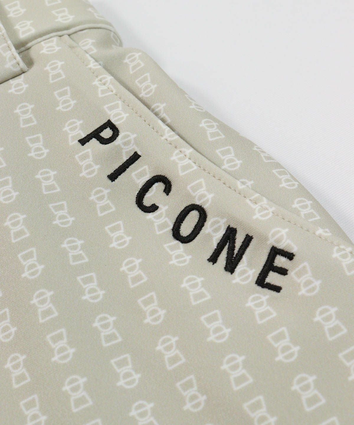 ロゴデザイン部分（ベージュ）